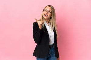 Business,Blonde,Woman,Isolated,On,Pink,Background,Intending,To,Realizes