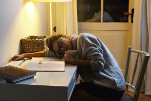 Tired,Woman,Student,Is,Sleeping,On,The,Desk,After,Long